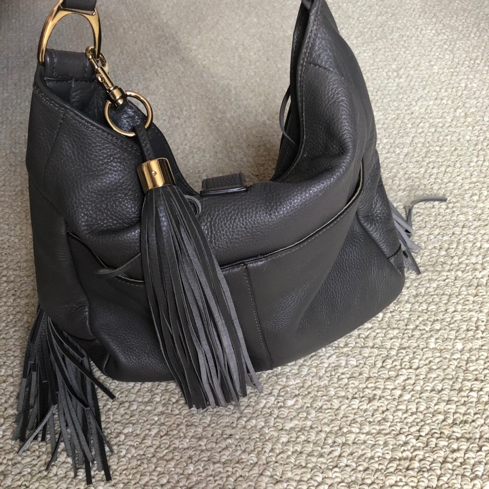 Purse hand bag. Leather with fringe.